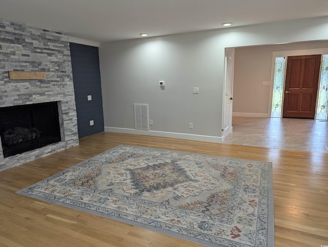 4719 National Dr, Myrtle Beach, SC 29579 - unfurnished living room featuring a fireplace, light wood finished floors, and recessed lighting