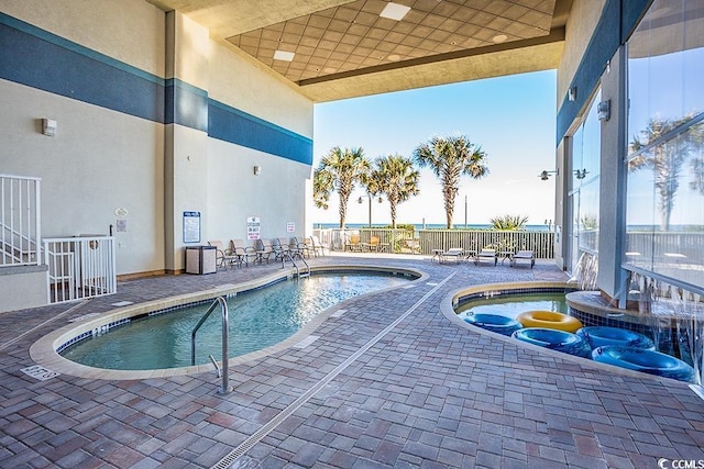 2504 N Ocean Blvd Unit 1730, Myrtle Beach, SC 29577 - community pool with a patio and a hot tub