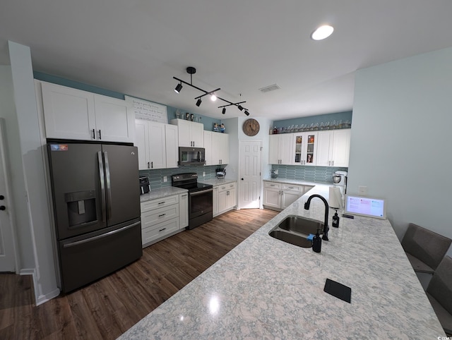 236 Haley Brooke Dr, Conway, SC 29526 - kitchen with electric range oven, stainless steel fridge, black microwave, glass insert cabinets, and decorative backsplash