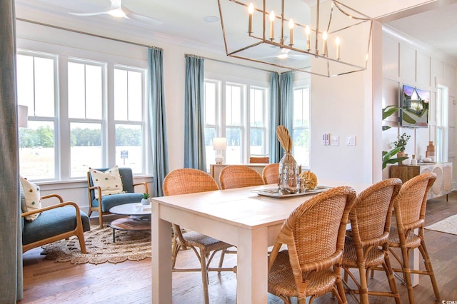 1627 Sayebrook Pkwy, Myrtle Beach, SC 29588 - dining area featuring wood finished floors, crown molding, and a chandelier