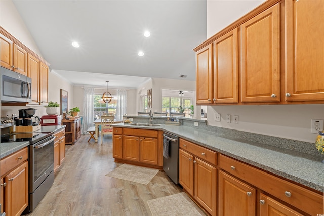 312 Caldera Ct, Murrells Inlet, SC 29576 - kitchen featuring appliances with stainless steel finishes, light wood-style flooring, recessed lighting, a peninsula, and brown cabinets