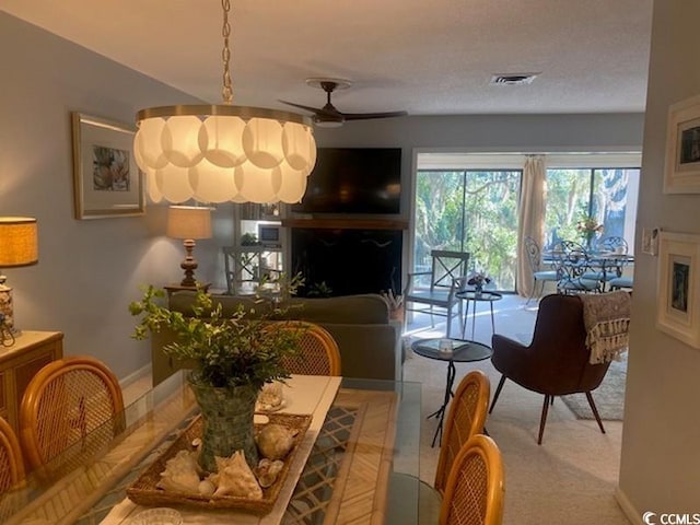 18 Canvas Back Cv Unit 122, Georgetown, SC 29440 - living area featuring a fireplace, ceiling fan, and carpet floors
