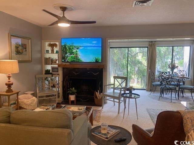 18 Canvas Back Cv Unit 122, Georgetown, SC 29440 - living area with ceiling fan and a high end fireplace