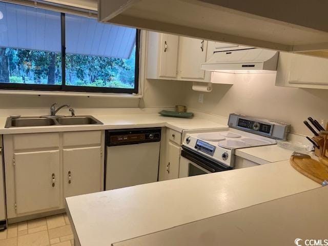 18 Canvas Back Cv Unit 122, Georgetown, SC 29440 - kitchen with stainless steel dishwasher, white electric range oven, custom range hood, white cabinetry, and light countertops