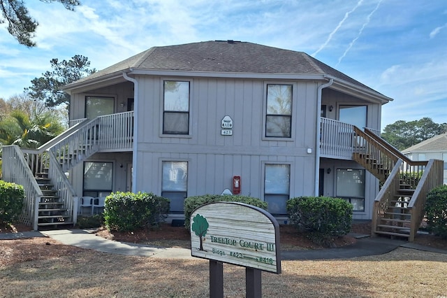 423 Tree Top Ct Unit 23-B, Myrtle Beach, SC 29588 - view of front of property with stairway, a shingled roof, and board and batten siding