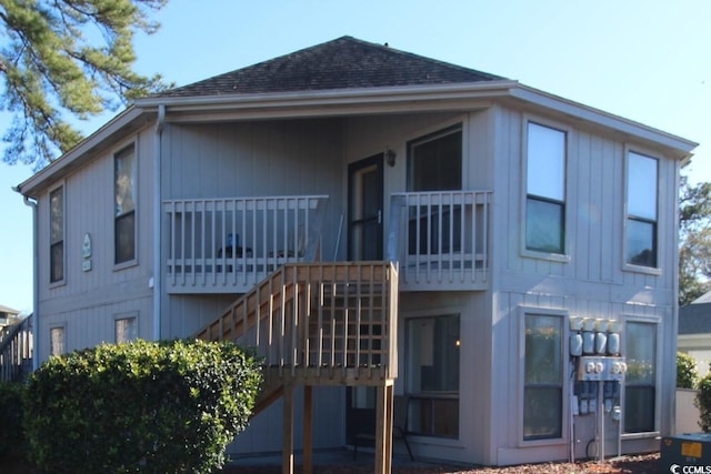 423 Tree Top Ct Unit 23-B, Myrtle Beach, SC 29588 - back of property with stairway and a shingled roof