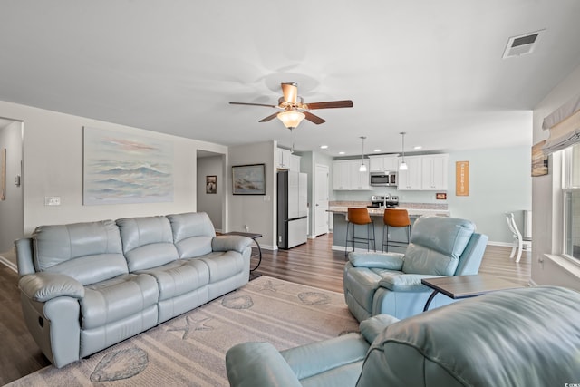 1108 Donald St, Conway, SC 29527 - living room featuring dark wood finished floors, a ceiling fan, and recessed lighting