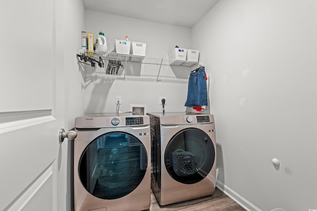 1108 Donald St, Conway, SC 29527 - laundry room featuring washer and clothes dryer and wood finished floors