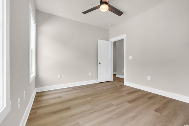 4329 Landing Rd, Little River, SC 29566 - empty room featuring ceiling fan, light wood-style flooring, and plenty of natural light