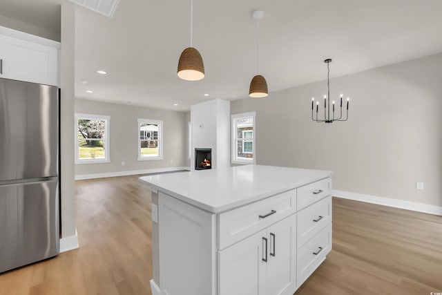4329 Landing Rd, Little River, SC 29566 - kitchen featuring freestanding refrigerator, light wood-type flooring, decorative light fixtures, light countertops, and recessed lighting