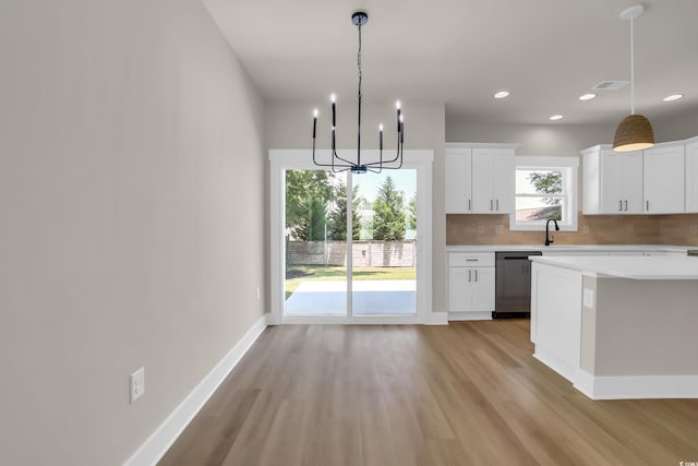4329 Landing Rd, Little River, SC 29566 - kitchen with dishwasher, light wood-style floors, light countertops, a chandelier, and recessed lighting
