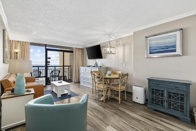 6900 N Ocean Blvd Unit 834, Myrtle Beach, SC 29572 - living area with a textured ceiling, wood finished floors, and ornamental molding