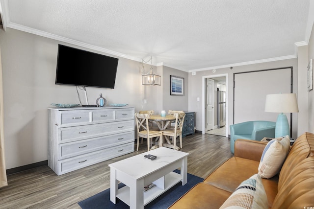 6900 N Ocean Blvd Unit 834, Myrtle Beach, SC 29572 - living area with wood finished floors, crown molding, a textured ceiling, and a chandelier