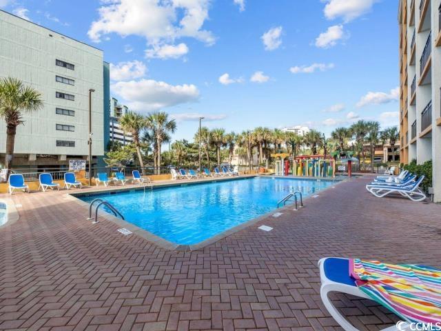 6900 N Ocean Blvd Unit 834, Myrtle Beach, SC 29572 - community pool featuring a patio