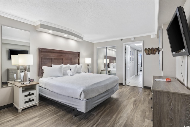 6900 N Ocean Blvd Unit 834, Myrtle Beach, SC 29572 - bedroom with a textured ceiling, wood finished floors, ornamental molding, and recessed lighting