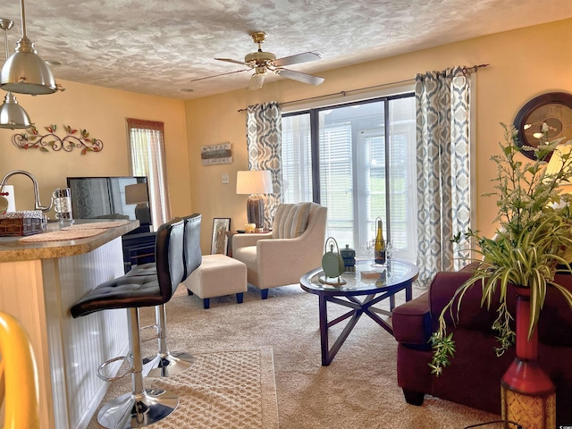 3700 Golf Colony Ln Unit 26-O, Little River, SC 29566 - carpeted living area with a textured ceiling and ceiling fan