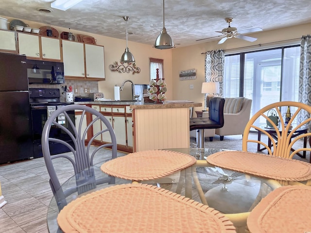 3700 Golf Colony Ln Unit 26-O, Little River, SC 29566 - dining room with plenty of natural light and a ceiling fan