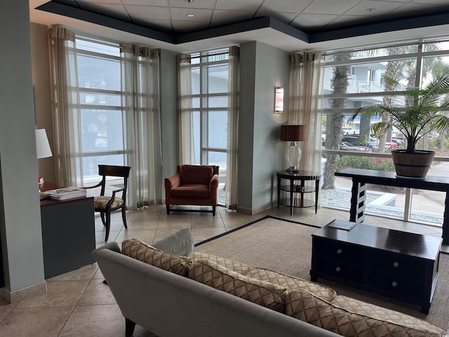 2100 Sea Mountain Hwy Unit 520, North Myrtle Beach, SC 29582 - living room with tile patterned flooring, a raised ceiling, and a paneled ceiling