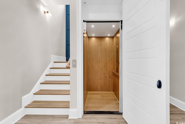 1112 Whispering Winds Dr, Myrtle Beach, SC 29579 - staircase featuring elevator and wood finished floors