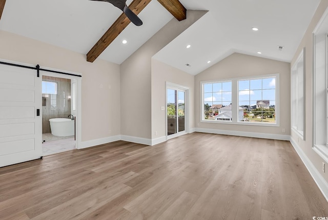 1112 Whispering Winds Dr, Myrtle Beach, SC 29579 - unfurnished living room with healthy amount of natural light, a ceiling fan, a barn door, recessed lighting, and light wood-style floors
