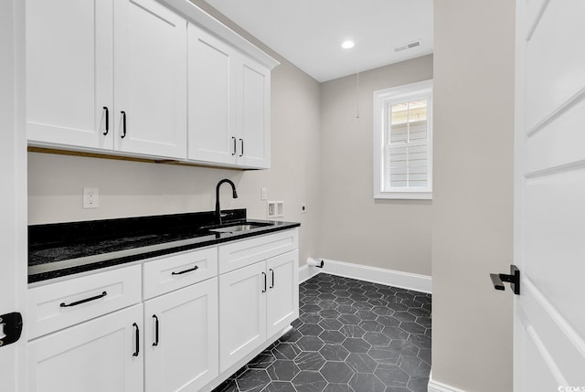 1112 Whispering Winds Dr, Myrtle Beach, SC 29579 - kitchen featuring dark countertops, white cabinets, and recessed lighting