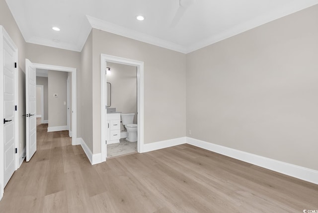 1112 Whispering Winds Dr, Myrtle Beach, SC 29579 - unfurnished bedroom featuring ornamental molding, light wood-type flooring, recessed lighting, and ensuite bath