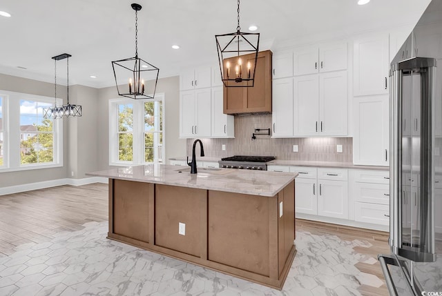 1112 Whispering Winds Dr, Myrtle Beach, SC 29579 - kitchen featuring a chandelier, high end refrigerator, tasteful backsplash, light stone counters, and white cabinets