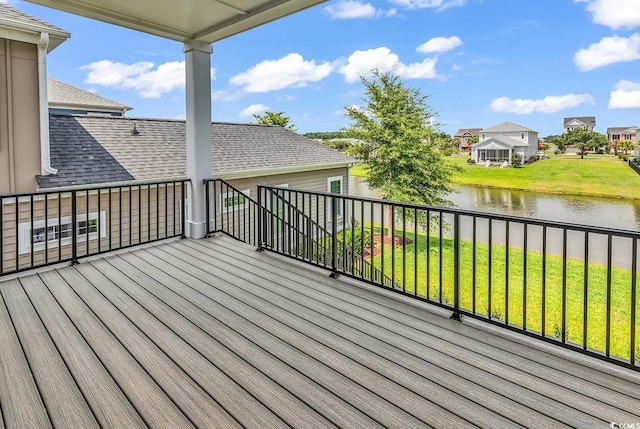 1112 Whispering Winds Dr, Myrtle Beach, SC 29579 - deck featuring a water view, a lawn, and a residential view