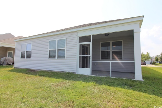2681 Ophelia Way, Myrtle Beach, SC 29577 - rear view of property featuring a lawn and a sunroom