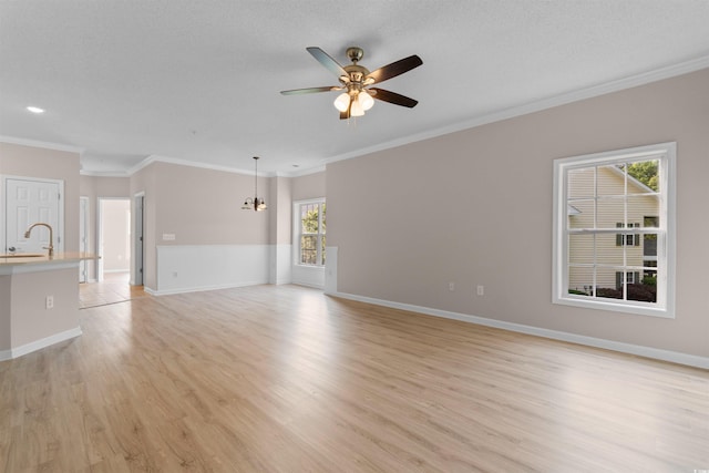5870 Longwood Dr Unit 201, Murrells Inlet, SC 29576 - unfurnished living room with a ceiling fan, light wood finished floors, ornamental molding, and a chandelier