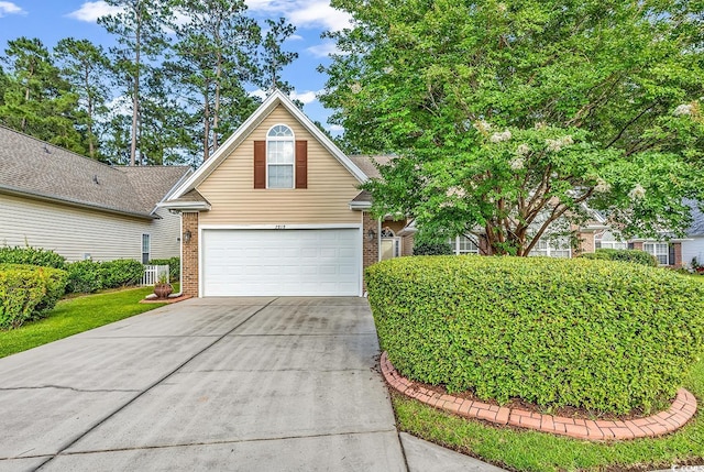 2818 Sanctuary Blvd, Conway, SC 29526 - view of front of property with brick siding, driveway, and a garage