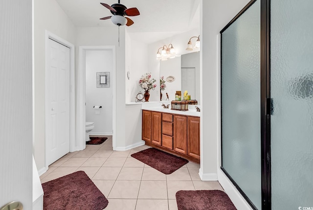 2818 Sanctuary Blvd, Conway, SC 29526 - bathroom featuring tile patterned flooring, double vanity, a shower stall, and ceiling fan