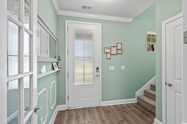 1007 Oak Marsh Ln, North Myrtle Beach, SC 29582 - entryway with crown molding, wood finished floors, and stairs