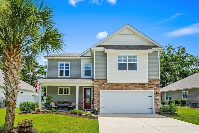 1007 Oak Marsh Ln, North Myrtle Beach, SC 29582 - craftsman inspired home with stone siding, concrete driveway, an attached garage, and covered porch