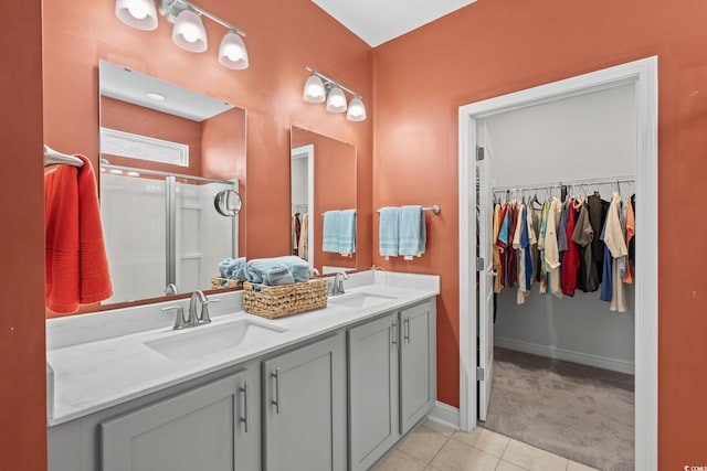 1007 Oak Marsh Ln, North Myrtle Beach, SC 29582 - full bathroom with double vanity, a stall shower, tile patterned flooring, and a spacious closet