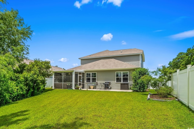 1007 Oak Marsh Ln, North Myrtle Beach, SC 29582 - back of house with a sunroom, a fenced backyard, a patio area, and roof with shingles