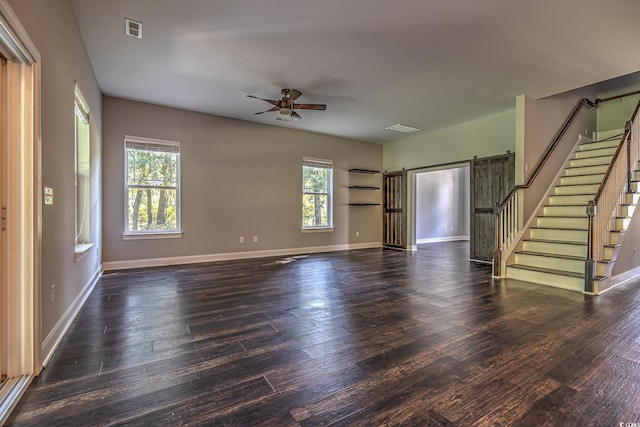 520 Oak Pond Ct, Conway, SC 29526 - unfurnished living room featuring healthy amount of natural light, ceiling fan, wood-type flooring, and stairway