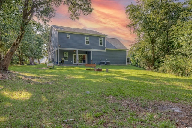 520 Oak Pond Ct, Conway, SC 29526 - rear view of property with a yard and a fire pit