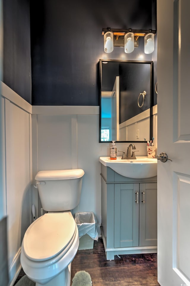 520 Oak Pond Ct, Conway, SC 29526 - bathroom featuring vanity, wood finished floors, a wainscoted wall, and a decorative wall
