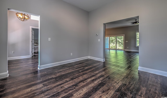 520 Oak Pond Ct, Conway, SC 29526 - unfurnished room featuring a chandelier, dark wood-type flooring, and a ceiling fan