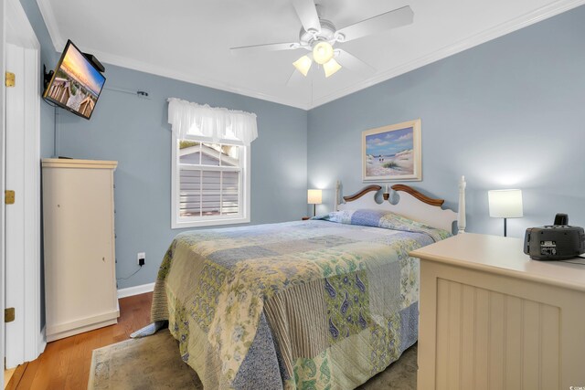 6001-Q21 S Kings Hwy, Myrtle Beach, SC 29575 - bedroom featuring wood finished floors, crown molding, and ceiling fan