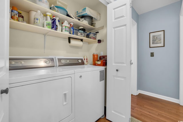 6001-Q21 S Kings Hwy, Myrtle Beach, SC 29575 - washroom featuring washer and clothes dryer and light wood-type flooring