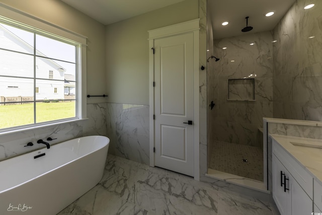 287 W Palms Dr, Myrtle Beach, SC 29579 - bathroom with a freestanding tub, a marble finish shower, marble tiled flooring, vanity, and recessed lighting