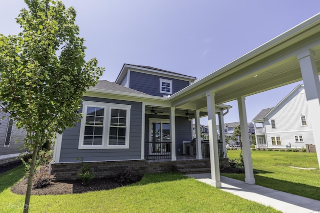 287 W Palms Dr, Myrtle Beach, SC 29579 - view of front of property featuring ceiling fan, covered porch, and a front yard