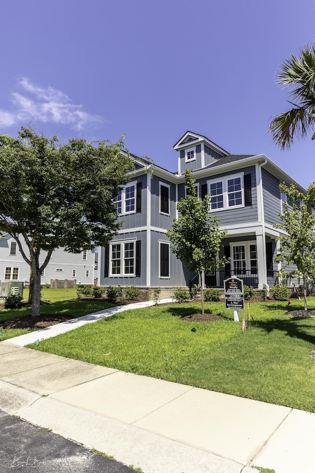 287 W Palms Dr, Myrtle Beach, SC 29579 - view of front of house featuring a front lawn and board and batten siding