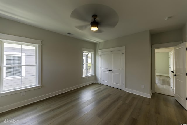 287 W Palms Dr, Myrtle Beach, SC 29579 - unfurnished bedroom with wood finished floors, a closet, and ceiling fan
