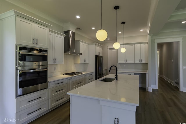 287 W Palms Dr, Myrtle Beach, SC 29579 - kitchen featuring wall chimney range hood, appliances with stainless steel finishes, dark wood finished floors, an island with sink, and decorative light fixtures