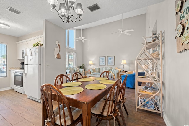 800 9th Ave S Unit N-1, North Myrtle Beach, SC 29582 - dining area with a textured ceiling, healthy amount of natural light, ceiling fan, a chandelier, and light wood finished floors