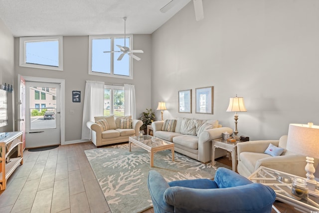 800 9th Ave S Unit N-1, North Myrtle Beach, SC 29582 - living area with ceiling fan, a towering ceiling, and light wood-style floors