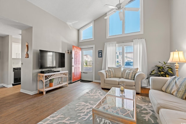 800 9th Ave S Unit N-1, North Myrtle Beach, SC 29582 - living area featuring a high ceiling, a ceiling fan, and wood-type flooring